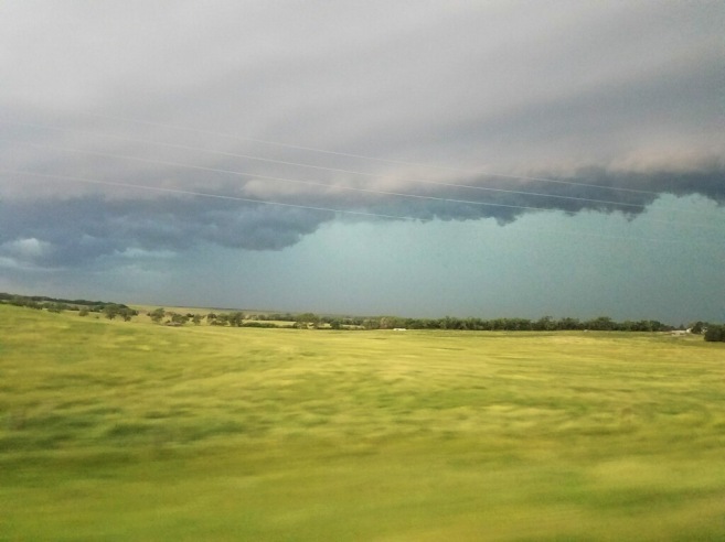 South Dakota storm clouds over green fields Michele Wytas